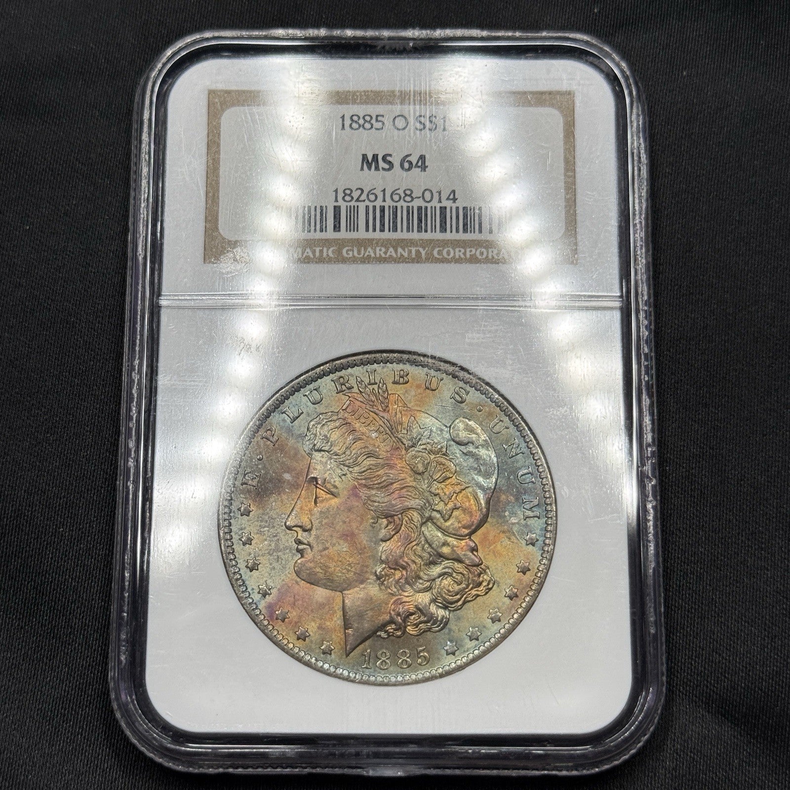 1885-O Morgan Silver Dollar NGC MS64 Rainbow Toned Colorful Original Toning